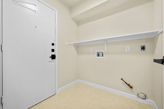 Laundry area with gas dryer hookup, washer hookup, and tile patterned flooring | Image 21
