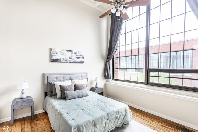 bedroom featuring wood-type flooring and ceiling fan | Image 19