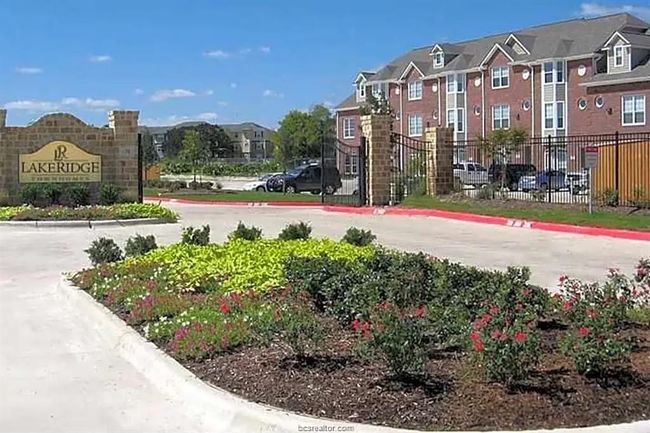 Community / neighborhood sign with a residential view and fence | Image 25