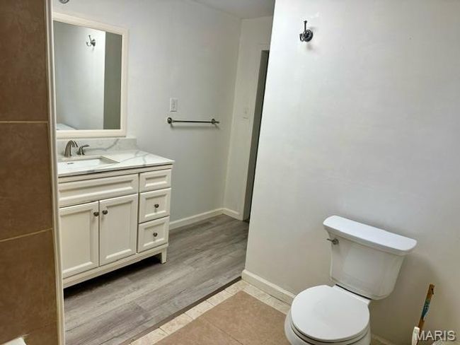 Bathroom with hardwood / wood-style floors, vanity, and toilet | Image 29