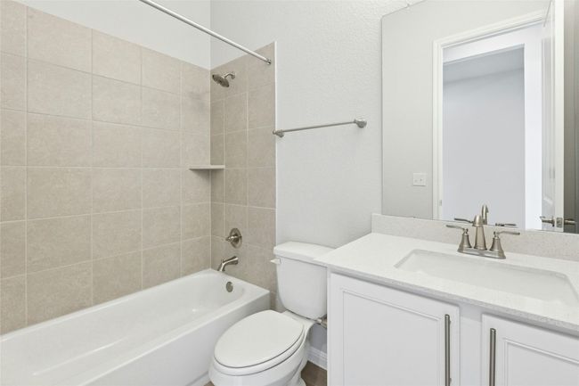 Bathroom featuring toilet, vanity, and shower / bathtub combination | Image 19