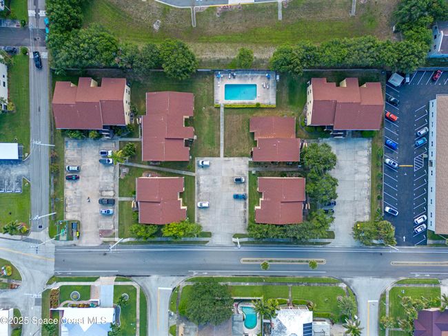 Aerial of condo complex and pool | Image 31