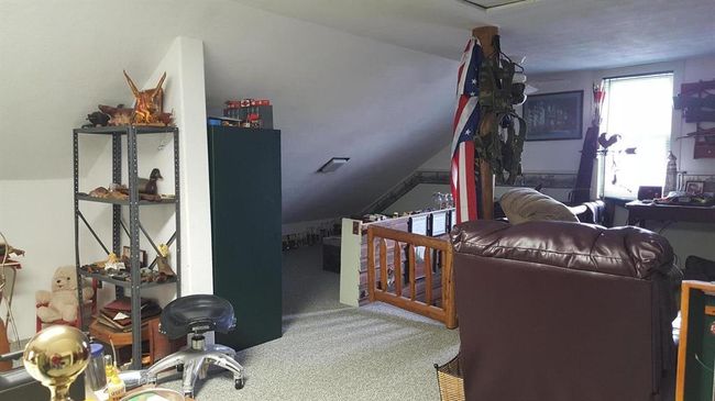Bedroom featuring carpet and vaulted ceiling | Image 34