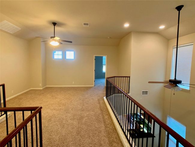 Hall featuring an upstairs landing, carpet flooring, recessed lighting, and baseboards | Image 11