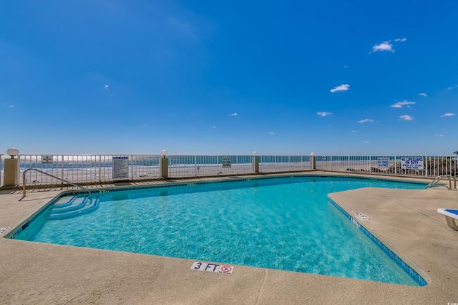 Community pool with a patio | Image 25