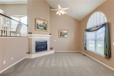 Great Room, 15' X 20', with energy efficient gas direct vent fireplace and tall ceiling. | Image 2