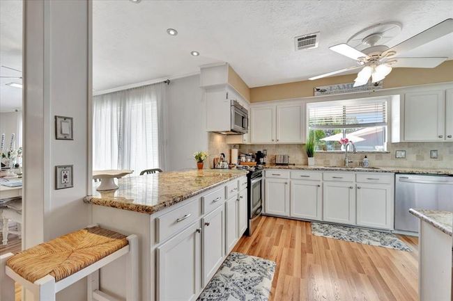 Notice this gorgeous flooring flows throughout the downstairs. | Image 22