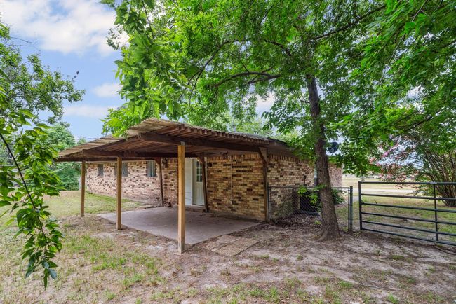 View of patio with a gate | Image 25