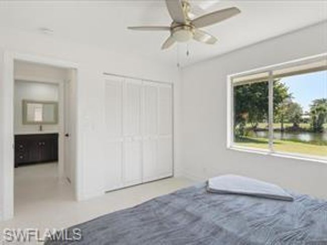 Carpeted bedroom with ceiling fan | Image 17