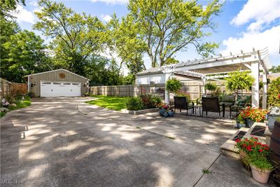 View of patio with a pergola and a garage | Image 2