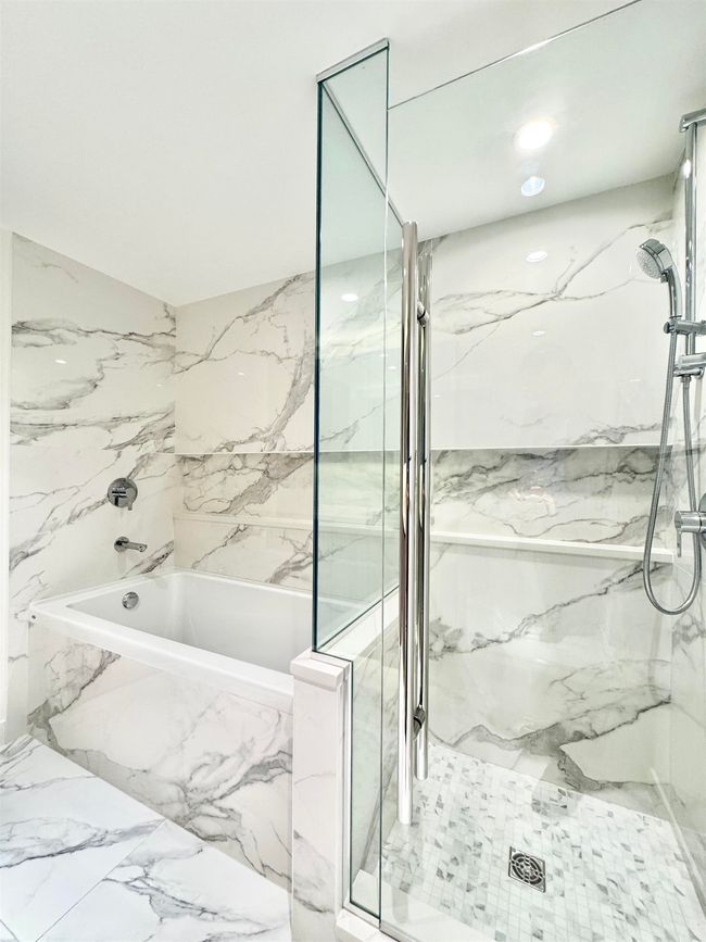 Full bath featuring a bath, a marble finish shower, and marble finish floor | Image 16