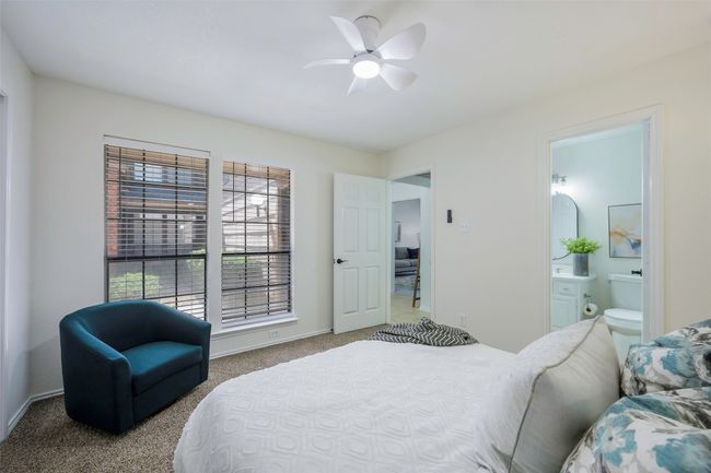 Bedroom with ensuite bath, baseboards, carpet floors, and ceiling fan | Image 6