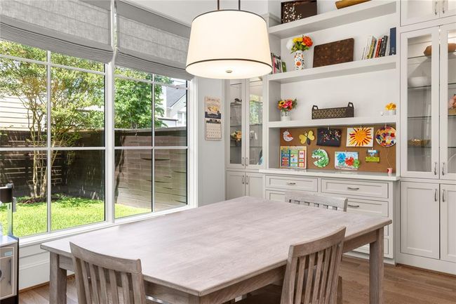 Custom cabinetry w/ glass doors and interior lighting. | Image 23