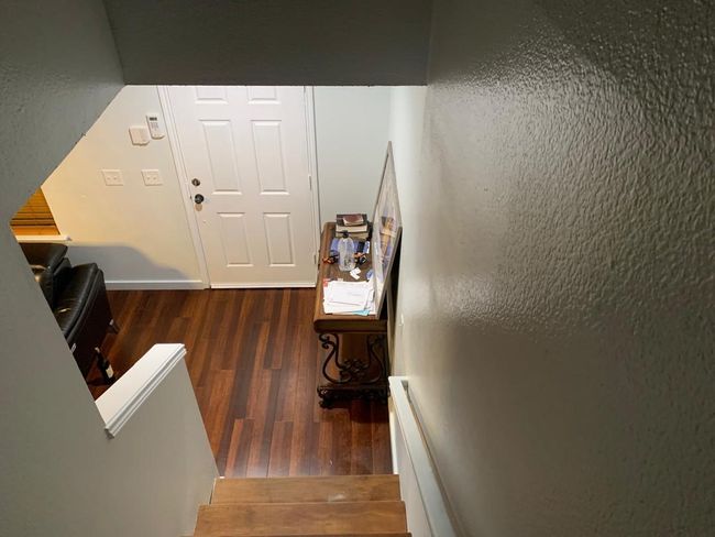 Stairs with wood finished floors and baseboards | Image 22
