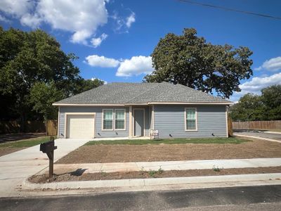 Single story home with a garage | Image 2