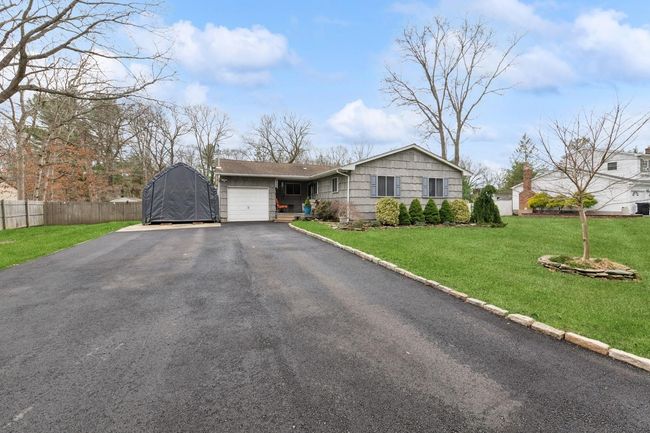 View of backyard with patio, a fenced in pool, outdoor structures, a shed, a gazebo | Image 24