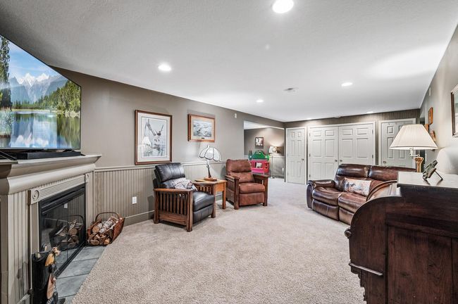 From cozy movie nights with family to lively gatherings with friends, this family room is perfect for every occasion. | Image 21