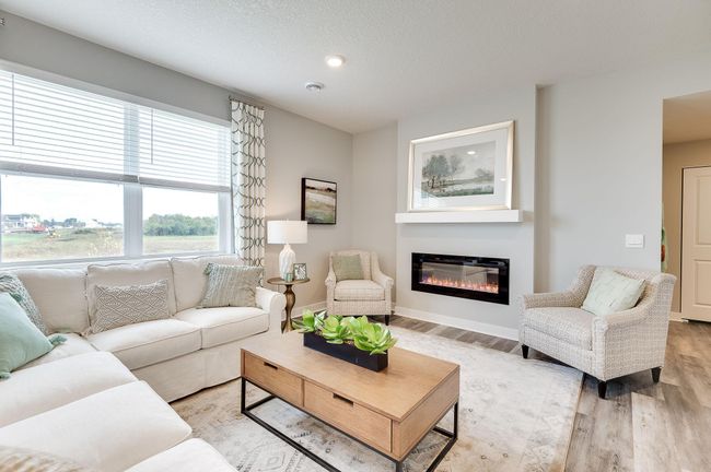 Electric fireplace can give off heat if you prefer! Previously built model home, finishes, selections, and colors to vary from future built home. | Image 13