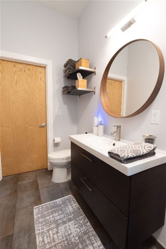 Bathroom featuring vanity and toilet | Image 10