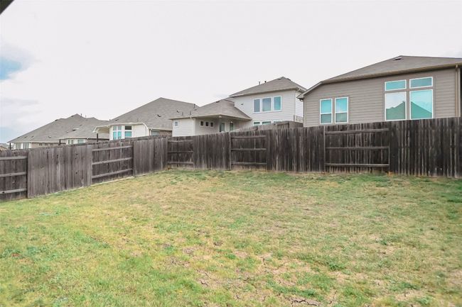 View of yard featuring a fenced backyard | Image 9
