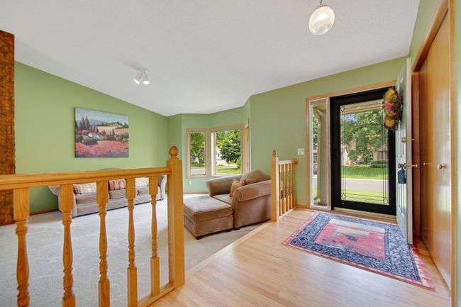 Light filled, and cheery, your front living area is graced with a vast front window and vaulted ceiling. | Image 7