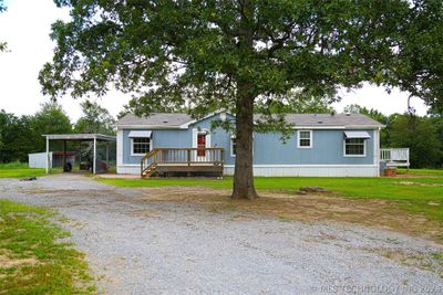 Front of home with covered parking. | Image 2