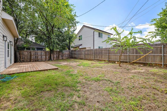 Fenced backyard featuring a deck | Image 26