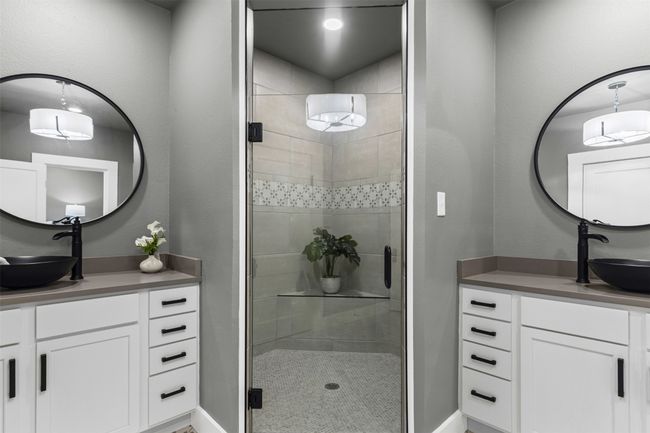 Full bathroom with a shower stall, vanity, and baseboards | Image 27