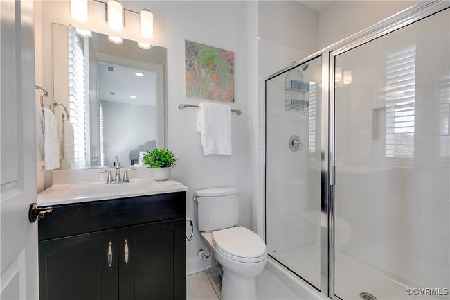 Full bath with a shower stall, toilet, and vanity | Image 43