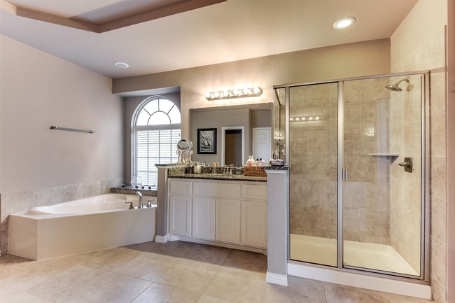 Bathroom with tile patterned floors, vanity, and shower with separate bathtub | Image 28