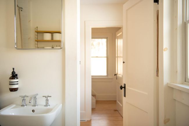 Bathroom featuring sink and hardwood / wood-style flooring | Image 13