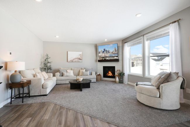 Great room with shiplap corner fireplace | Image 21