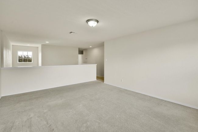 Empty room with visible vents, light carpet, baseboards, and recessed lighting | Image 15