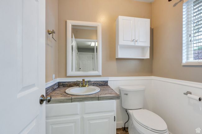 Half bathroom with toilet and vanity | Image 19
