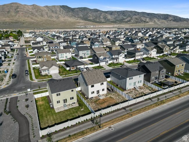 Aerial view of property's location featuring nearby suburban area and a mountainous background | Image 34