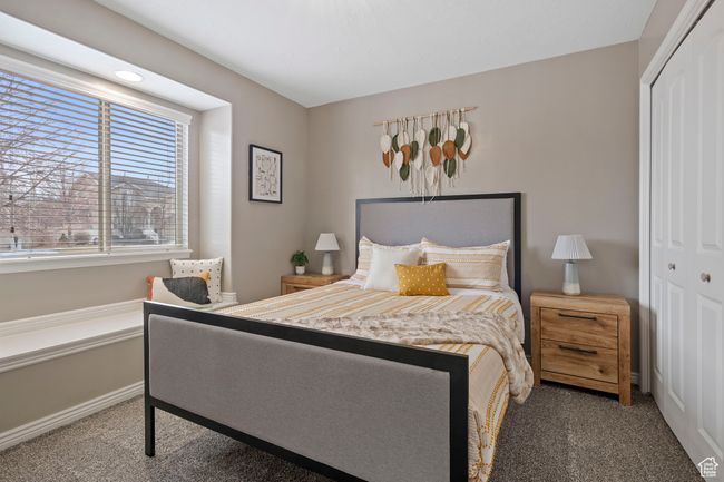 Bedroom with a closet and carpet flooring | Image 16