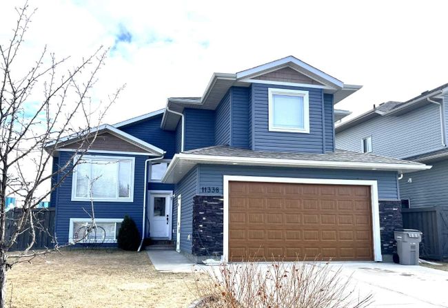 11338 59 Avenue, Home with 3 bedrooms, 2 bathrooms and 4 parking in Grande Prairie AB | Image 1