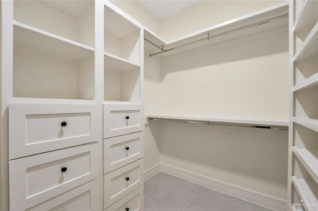 Walk in closet featuring light tile patterned flooring | Image 16