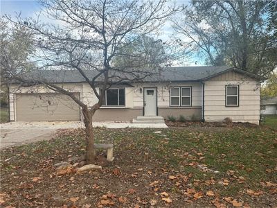 View of front of property with a garage | Image 1