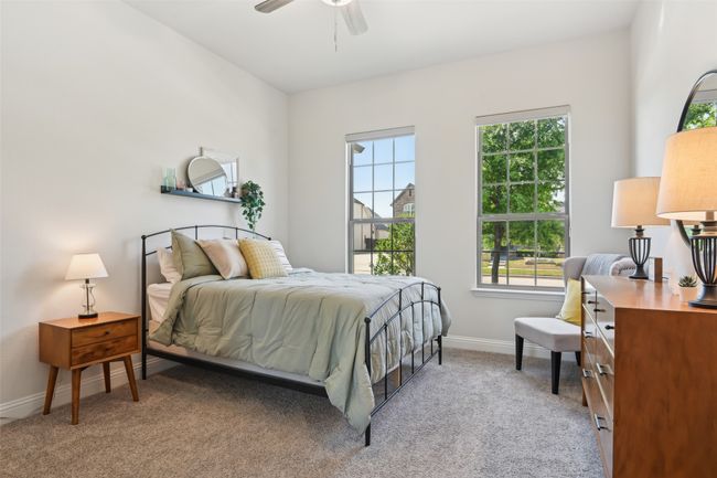 Bedroom with multiple windows, carpet floors, and a ceiling fan | Image 33
