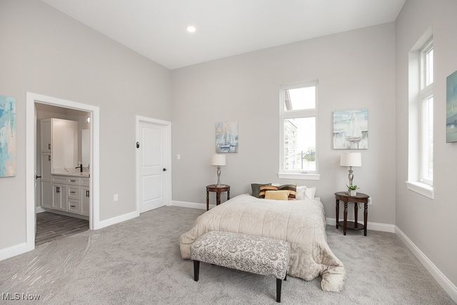 Bedroom with light wood-type flooring and ensuite bathroom | Image 28