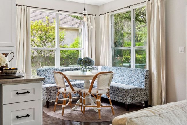 The kitchen also features a sunny breakfast area in corner windows. | Image 12
