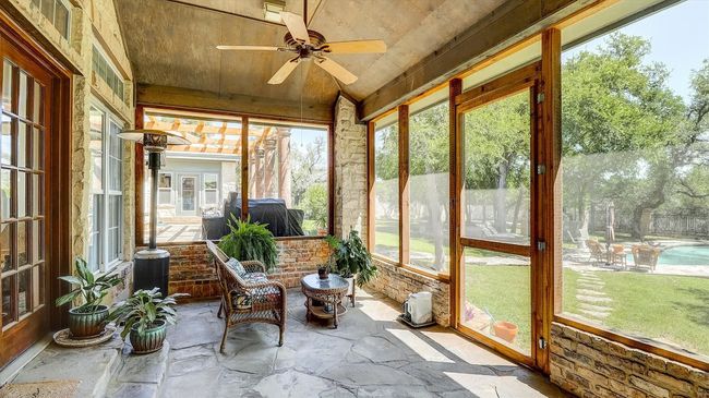 Sunroom/ screened patio located off the primary bedroom with exits from both the bedroom and bath | Image 29