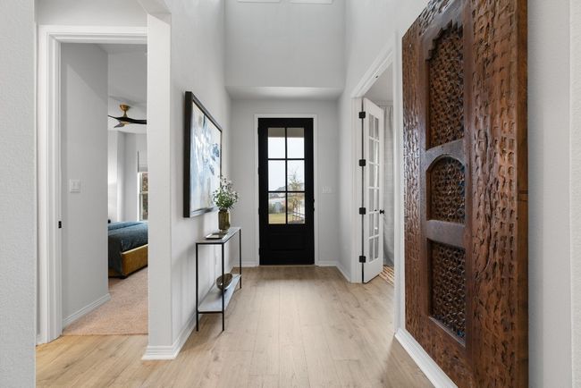 The home office space is right off of the entryway and features a French door entry. | Image 5