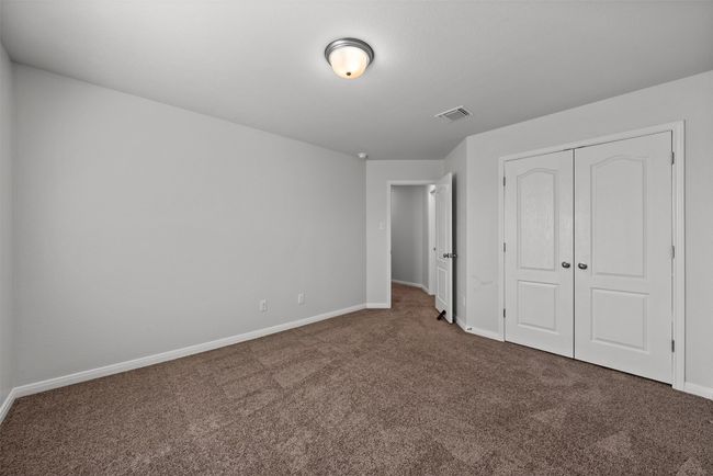 Unfurnished bedroom featuring carpet floors and a closet | Image 31