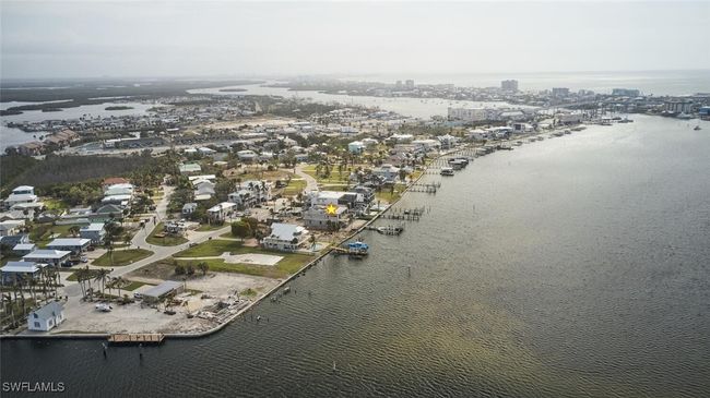 Aerial overview of property's location featuring a nearby body of water and nearby urban area | Image 35
