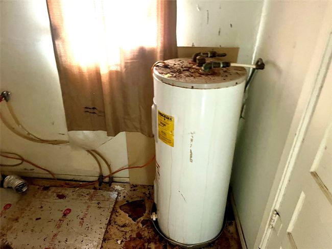 Utilities featuring water heater | Image 11