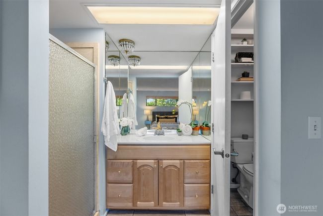 Refreshed primary bath with shower and separate toilet room. | Image 23