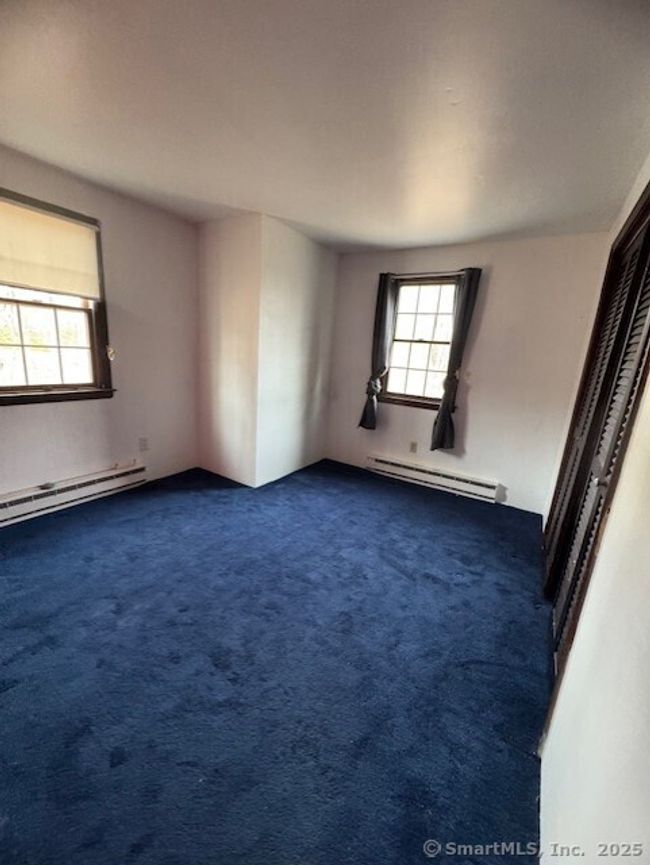 2nd floor bedrrom, two have laminate floors, one with carpet | Image 9