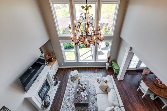 View from the loft into the great room showcasing the dramatic windows! | Image 32